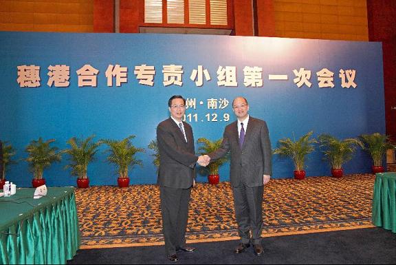 Mr Tam (right) and Mr Chen shake hands before the first meeting of the Hong Kong/Guangzhou Co-operation Working Group in Nansha, Guangzhou.