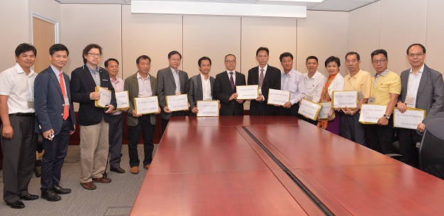 Mr Lau (centre) receives the Federation of Hong Kong Shenzhen Associations'' submissions on constitutional development.