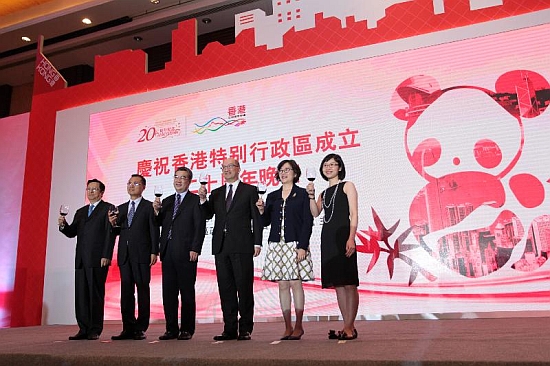 The Secretary for Constitutional and Mainland Affairs, Mr Raymond Tam (third right), and the Vice Governor of Sichuan Provincial Government, Mr Zhu Hexin (third left), toasting at the gala dinner in celebration of the 20th anniversary of the establishment of the Hong Kong Special Administrative Region (HKSAR) today (June 11). Also present are the Director of Chengdu Economic and Trade Office of the HKSAR Government, Miss Pamela Lam (second right); the Administrative Assistant to the Secretary for Constitutional and Mainland Affairs, Ms Joanne Chu (first right); the Deputy Secretary-General of the Sichuan Provincial People's Government, Mr Zhao Weiping (second left); and the Director-General of the Hong Kong and Macao Affairs Office, Sichuan Provincial People's Government, Mr Mu Xinhai (first left).