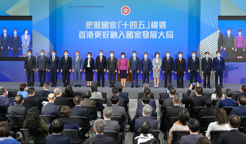 (From sixth left) The Secretary for Justice, Ms Teresa Cheng, SC; the Financial Secretary, Mr Paul Chan; the Chief Secretary for Administration, Mr John Lee; the Chief Executive, Mrs Carrie Lam; the Director of the Liaison Office of the Central People's Government in the Hong Kong Special Administrative Region, Mr Luo Huining; Deputy Director of the Hong Kong and Macao Affairs Office of the State Council Mr Huang Liuquan; and other guests are pictured at the talk on the National 14th Five-Year Plan. 