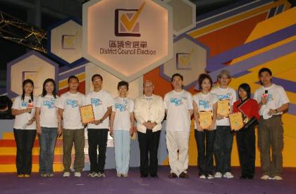 Photo shows (from left) the Secretary for Constitutional and Mainland Affairs, Mr Stephen Lam (seventh); the Chairman of the Electoral Affairs Commission, Mr Justice Pang Kin-kee (sixth); the Director of Home Affairs, Mrs Pamela Tan (fifth); and the Acting Director of Broadcasting, Ms Gracie Foo (second), taking a photo with participants and the Election Ambassadors, Miss Joey Yung (eighth) and Mr Anthony Wong (ninth) after the 2007 District Council Election launching ceremony