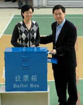 Photo shows the Secretary for Constitutional and Mainland Affairs, Mr Stephen Lam, and Mrs Lam casting their votes in the 2007 Legislative Council Hong Kong Island Geographical Constituency By-election at the HKCCGA Cheng Jack Yiu School Polling Station in Stanley this (December 2) morning