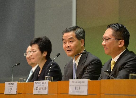 Mr Leung (second right) responses to a question at the press conference.