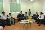 Photo shows Mr Lam sharing his experiences in learning and in life with a study group comprising local and ethnic minority students.