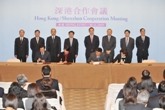 Mr Tang and Mr Wang witness the signing of seven co-operation agreements between Hong Kong and Shenzhen.