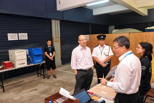 The Secretary for Constitutional and Mainland Affairs, Mr Raymond Tam (fourth right), visited the dedicated polling station at the Tin Sum Police Station, Sha Tin, this morning (September 9).