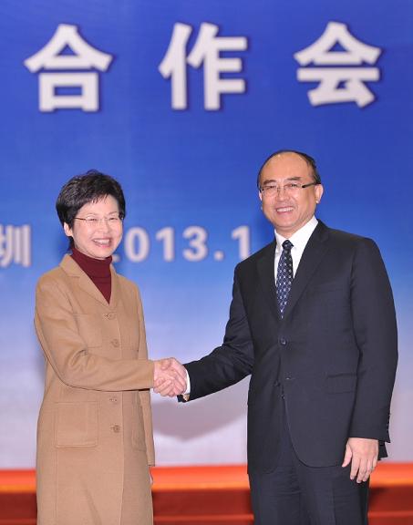 Mrs Lam (left) and Mr Xu photographed before the meeting.
