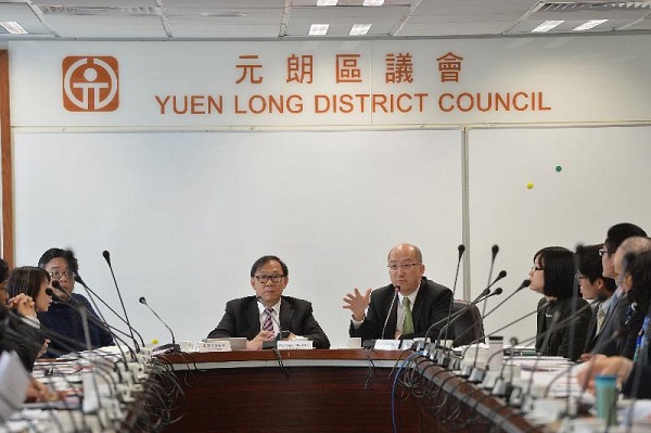 The Secretary for Constitutional and Mainland Affairs, Mr Raymond Tam (centre right), attends a meeting with Yuen Long District Council this morning (February 25) to brief council members on the "Consultation Document on the Methods for Selecting the Chief Executive in 2017 and for Forming the Legislative Council in 2016" and to listen to their views.