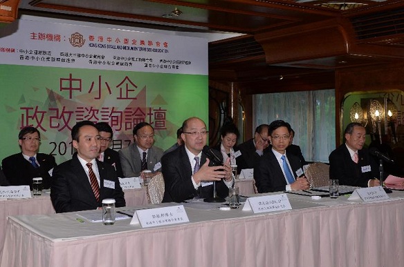 The Secretary for Constitutional and Mainland Affairs, Mr Raymond Tam (front row, second left), and the Acting Secretary for Commerce and Economic Development, Mr Godfrey Leung (front row, second right), attend a constitutional development forum organised by the Hong Kong Small and Medium Enterprises Association to exchange views with participants on the "Consultation Document on the Methods for Selecting the Chief Executive in 2017 and for Forming the Legislative Council in 2016" this afternoon (March 7).