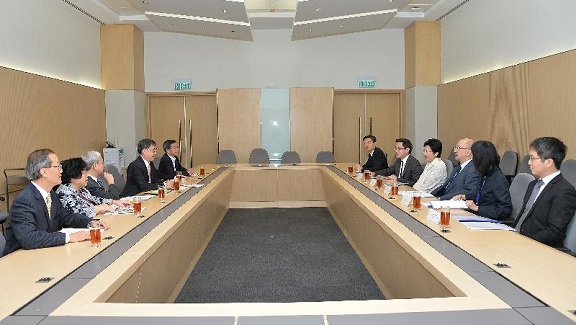 The Chief Secretary for Administration, Mrs Carrie Lam (fourth right), and the Secretary for Constitutional and Mainland Affairs, Mr Raymond Tam (third right), meet with academics to exchange views on the "Consultation Document on the Methods for Selecting the Chief Executive in 2017 and for Forming the Legislative Council in 2016" this afternoon (April 30).