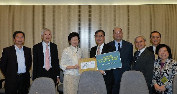 Mrs Lam (third left) receives the academics'' submission on constitutional development.