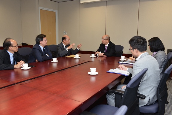 The Secretary for Constitutional and Mainland Affairs, Mr Raymond Tam, meets with the Federation of Hong Kong Industries to exchange views with participants on the "Consultation Document on the Methods for Selecting the Chief Executive in 2017 and for Forming the Legislative Council in 2016" this morning (April 24). Photo shows Mr Tam (fourth left) listening to the views of the participants.