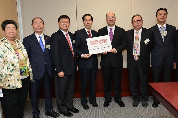 Mr Tam (third right) receives the submissions on constitutional development by the Hong Kong Association for the Promotion of Peaceful Reunification of China.