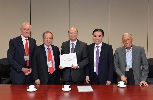 Mr Tam (centre) receives the BPF''s submission on constitutional development.