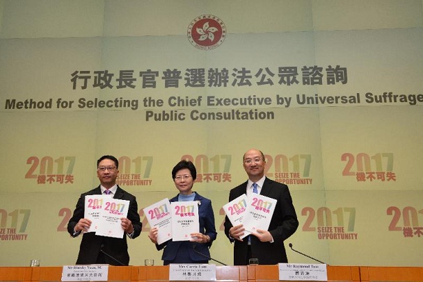 The Chief Secretary for Administration, Mrs Carrie Lam (centre); the Secretary for Justice, Mr Rimsky Yuen, SC (left); and the Secretary for Constitutional and Mainland Affairs, Mr Raymond Tam (right), hold a press conference on the Method for Selecting the Chief Executive by Universal Suffrage Public Consultation at Central Government Offices this afternoon (January 7).