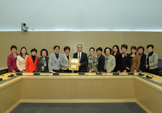 Mr Lau (seventh left) receives from the All-China Women''s Federation Hong Kong Delegates Association their submissions on constitutional development.