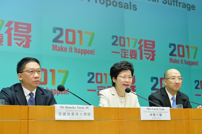 Mrs Lam (centre) speaks at the press conference.