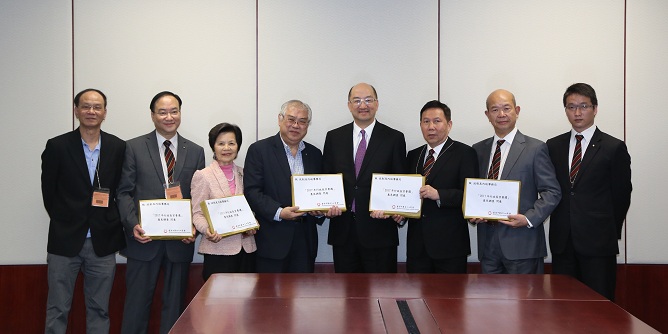 The Secretary for Constitutional and Mainland Affairs, Mr Raymond Tam, today (May 11) met with representatives of the Hong Kong Chinese Importers'' & Exporters'' Association and listened to its briefing on the results of a survey it conducted on the proposals on the method for selecting the Chief Executive by universal suffrage in 2017. Photo shows representatives of the Association submitting the survey results to Mr Tam (fourth right).