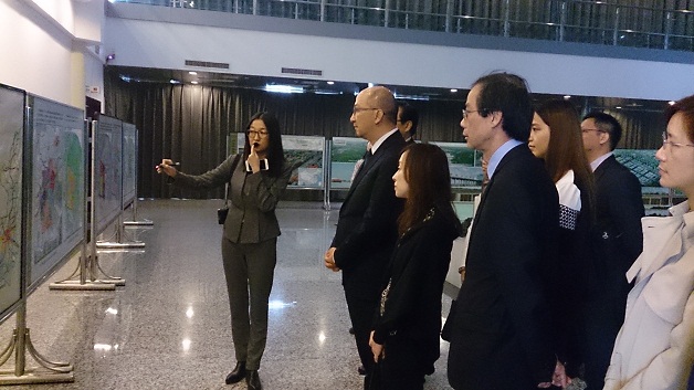 The delegation of the Hong Kong Special Administrative Region Government (HKSARG) led by the Secretary for Constitutional and Mainland Affairs, Mr Raymond Tam, visited facilities related to the Belt and Road Initiative in Xi''an this morning (October 16) to get a better understanding of Shaanxi Province''s latest developments in support of the initiative. Photo shows Mr Tam (second left) and delegation members being briefed on the role of Xi''an International Trade and Logistics Park in attracting foreign investment and the operation of freight services linking Xi''an with central Asia and Europe.
