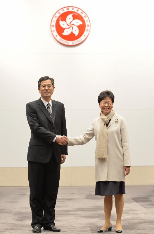 Mrs Lam (right) with Mr He (left) before the meeting.