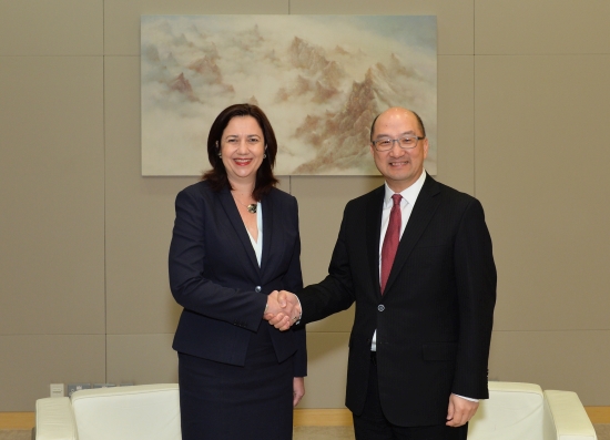 Mr Tam (right) and Ms Palaszczuk shake hands before the meeting.