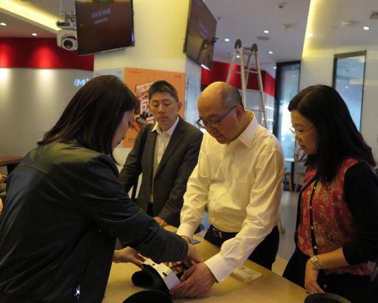 Mr Tam visited Zhongguancun to learn about the latest developments in the national new and high technology industrial development zone. Photo shows Mr Tam (second right) being introduced to the creative products of a company in the zone.