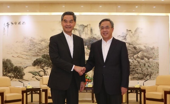 The Chief Executive, Mr C Y Leung, led the Hong Kong Special Administrative Region Government delegation to attend the 19th Plenary of the Hong Kong/Guangdong Co-operation Joint Conference in Guangzhou today (September 14). Photo shows Mr Leung (left) shaking hands with the Secretary of the CPC Guangdong Provincial Committee, Mr Hu Chunhua (right), at a meeting before the Plenary.