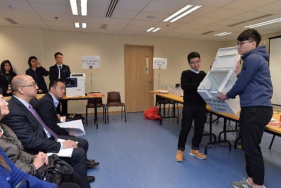 The Secretary for Constitutional and Mainland Affairs, Mr Raymond Tam, today (February 13) visited the Registration and Electoral Office to get updates on the concrete arrangements and preparations for the 2017 Chief Executive Election to be held next month. Photo shows Mr Tam (second left) being shown the design of the ballot box.
