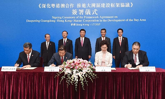 The Chief Executive of the Hong Kong Special Administrative Region, Mrs Carrie Lam (front row, second right), today (July 1) signed the Framework Agreement on Deepening Guangdong-Hong Kong-Macao Cooperation in the Development of the Bay Area with the Chairman of the National Development and Reform Commission, Mr He Lifeng (front row, second left); the Governor of Guangdong Province, Mr Ma Xingrui (front row, first left); and the Chief Executive of the Macao Special Administrative Region, Mr Chui Sai-on (front row, first right). This was witnessed by President Xi Jinping (back row, centre); State Councillor Mr Yang Jiechi (back row, second left); Vice-Chairman of the National Committee of the Chinese People's Political Consultative Conference Mr C Y Leung (back row, second right); the Director of the Hong Kong and Macao Affairs Office of the State Council, Mr Wang Guangya (back row, first left); and the Director of the Liaison Office of the Central People's Government in the Hong Kong Special Administrative Region, Mr Zhang Xiaoming (back row, first right).