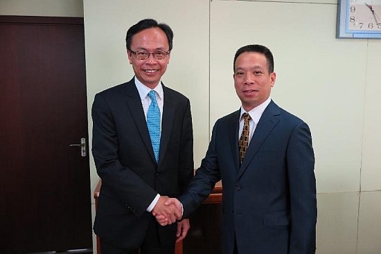 The Secretary for Constitutional and Mainland Affairs, Mr Patrick Nip (left), met with the Deputy Director of the Hong Kong and Macao Affairs Office of the State Council, Mr Huang Liuquan, in Beijing today (August 16). Picture shows them shaking hands before the meeting.