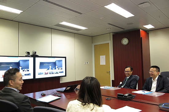 The Secretary for Constitutional and Mainland Affairs, Mr Patrick Nip (second right), today (August 17) conducted a video conference with colleagues of the Hong Kong Special Administrative Region (HKSAR) Government's offices in the Mainland and Taiwan to get an up-to-date briefing on the offices' work and their work plans for the coming year. Mr Nip said he hoped that the offices and their related liaison offices would enhance communication and liaison with the relevant central ministries as well as provincial and municipal authorities on various Mainland-related issues, including the development plan for a city cluster in the Guangdong-Hong Kong-Macao Bay Area, the Belt and Road Initiative, regional co-operation and facilitation measures for Hong Kong people, so that Hong Kong can have a better grasp of the related development opportunities and contribute to the country's developments. Mr Nip also thanked colleagues for their effort in organising activities to celebrate the 20th anniversary of the establishment of the HKSAR, and encouraged them to continue to play a "middle man" role to enable people in the Mainland and Taiwan to have a better understanding of Hong Kong. Also joining the meeting were the Permanent Secretary for Constitutional and Mainland Affairs, Mr Roy Tang (left), and the Under Secretary for Constitutional and Mainland Affairs, Mr Andy Chan (right).
