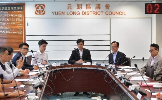 The Secretary for Constitutional and Mainland Affairs, Mr Patrick Nip, visited Yuen Long today (August 29) and met with members of the Yuen Long District Council (YLDC) to gain a better grasp of the district's developments and needs. Picture shows Mr Nip (second right) exchanging views with YLDC members in the company of the Chairman of the YLDC, Mr Shum Ho-kit (third right), and the District Officer (Yuen Long), Mr Edward Mak (first right).