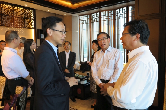The Secretary for Constitutional and Mainland Affairs, Mr Patrick Nip (left), meets with representatives of Hong Kong enterprises in Zhuhai today (September 7) to exchange views on the development of the Bay Area.