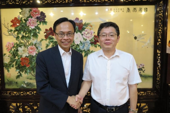 The Secretary for Constitutional and Mainland Affairs, Mr Patrick Nip (left), meets with the Director General of the Department of Regional Economy of the National Development and Reform Commission, Mr Guo Lanfeng, in Beijing on September 13 to exchange views on the development of the Guangdong-Hong Kong-Macao Bay Area.