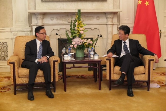 The Secretary for Constitutional and Mainland Affairs, Mr Patrick Nip (left), meets with the Executive Vice Mayor of Beijing, Mr Zhang Gong, in Beijing on September 13 to exchange views on enhancing exchanges and co-operation between Beijing and Hong Kong.