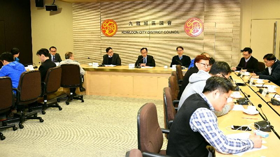 The Secretary for Constitutional and Mainland Affairs, Mr Patrick Nip (back row, centre), accompanied by the District Officer (Kowloon City), Mr Franco Kwok (back row, left), meets with the Chairman of the Kowloon City District Council (KCDC), Mr Pun Kwok-wah (back row, right), and members of the KCDC today (December 11) to exchange views on social and district matters.