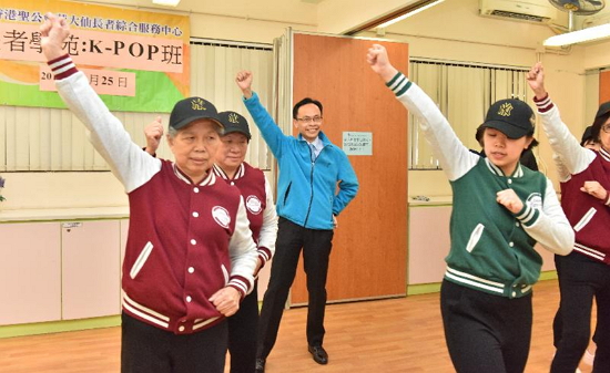 The Secretary for Constitutional and Mainland Affairs, Mr Patrick Nip, visited the Hong Kong Sheng Kung Hui Wong Tai Sin District Elderly Community Centre in Wong Tai Sin today (January 25). Photo shows Mr Nip (third right) dancing with a group of elderly people in a dancing class.