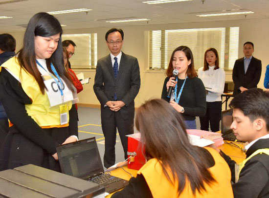 The Secretary for Constitutional and Mainland Affairs, Mr Patrick Nip, visited the Registration and Electoral Office (REO) today (January 30) and was briefed on the preparatory work for the 2018 Legislative Council By-election. Picture shows Mr Nip (second left) being given an update by REO staff on the polling and counting arrangements.