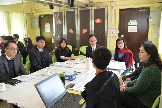 The Secretary for Constitutional and Mainland Affairs, Mr Patrick Nip, visited the hotline service centre for sexual minorities operated by the Tung Wah Group of Hospitals today (February 12). Photo shows Mr Nip (fourth left) being briefed on the services and operation of the hotline centre.