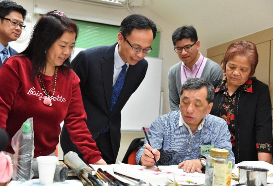 The Secretary for Constitutional and Mainland Affairs, Mr Patrick Nip, visited Kwai Tsing District today (March 2). Photo shows Mr Nip (third left) touring Baptist Oi Kwan Social Service lntegrated Community Centre for Mental Wellness (Kwai Tsing District) and chatting with participants of the calligraphy and painting class.