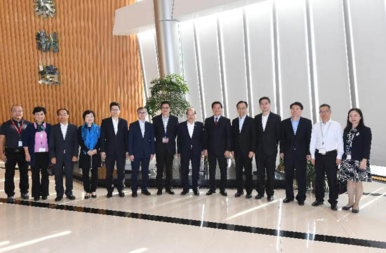 The Chief Secretary for Administration, Mr Matthew Cheung Kin-chung, today (November 29) led a delegation of Hong Kong Special Administrative Region Government officials to visit a Hong Kong enterprise that invested in the setting up of factories in Xiamen. Photo shows Mr Cheung (seventh right); the Secretary for Constitutional and Mainland Affairs, Mr Patrick Nip (fifth right); the Under Secretary for Innovation and Technology, Dr David Chung (sixth left); the Under Secretary for Education, Dr Choi Yuk-lin (fourth left); the Under Secretary for Commerce and Economic Development, Dr Bernard Chan (fourth right); the Under Secretary for Financial Services and the Treasury, Mr Joseph Chan (fifth left); and the Under Secretary for Home Affairs, Mr Jack Chan (seventh left); the Director of the Hong Kong Economic and Trade Office in Guangdong of the Government of the Hong Kong Special Administrative Region, Mr Albert Tang (third left), with the Chairman of the enterprise.